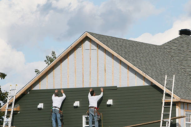 Professional Storm Damage Siding Repair technician working in Freeland, WA